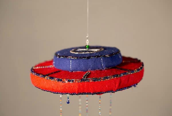 The side of a felt and beaded chime.