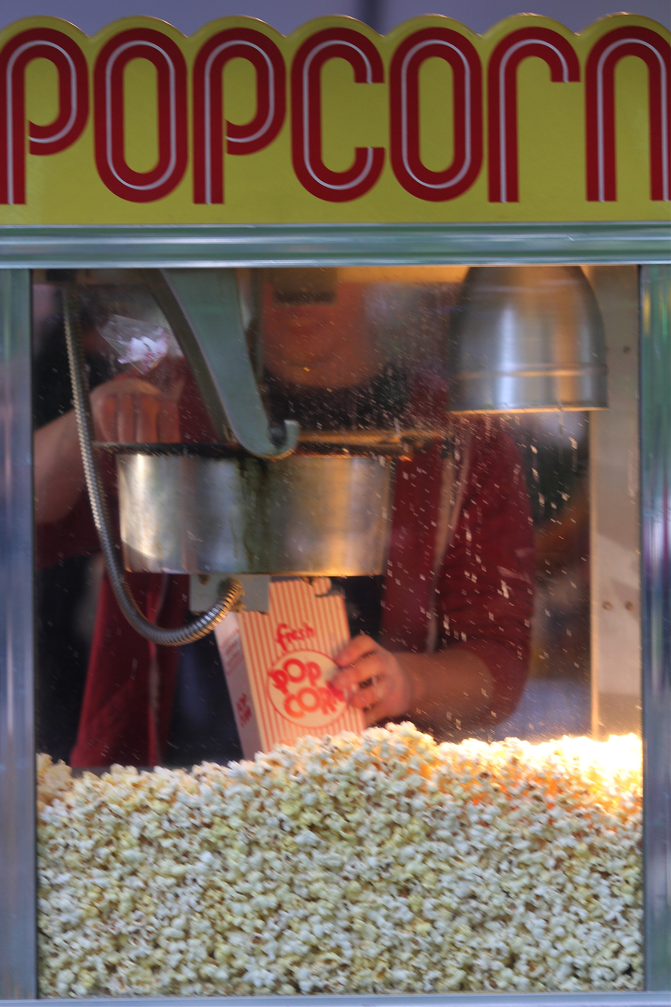 A person hands another person a piece of pie and ice cream on a plate.