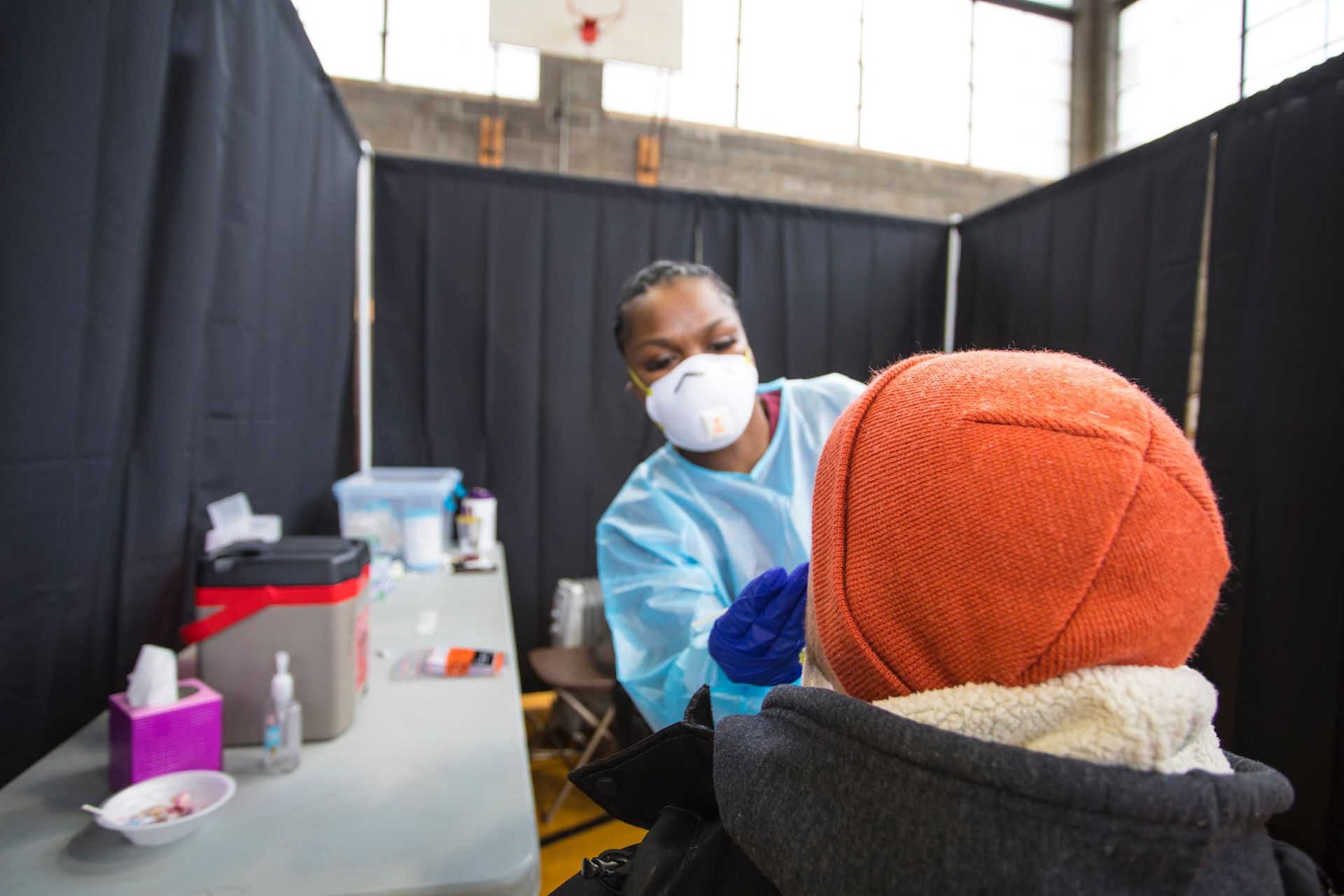 A student's nose is swabbed during a COVID test.