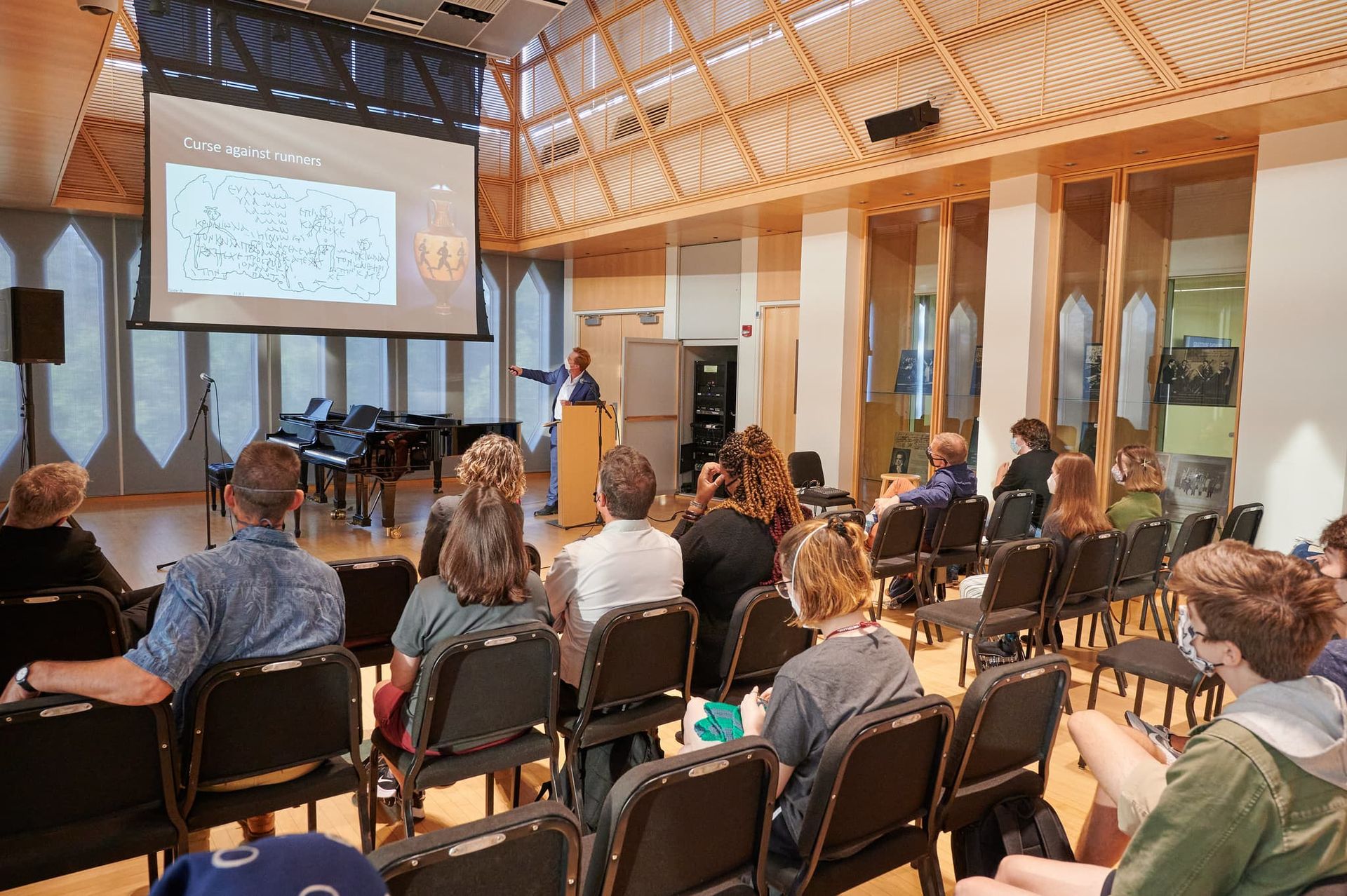 A man speaks at a podium.
