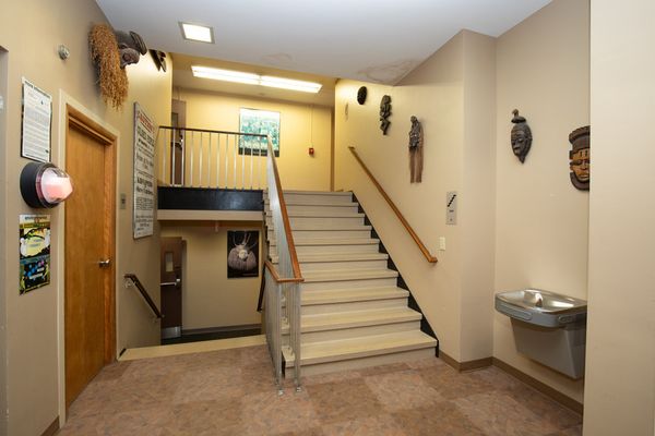African masks on display on the walls of the residence hall hallway.