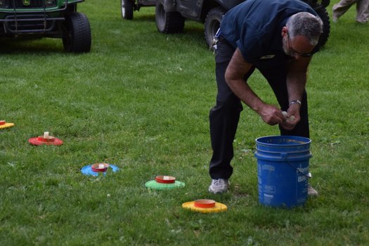 A man removed candles from a barrel.