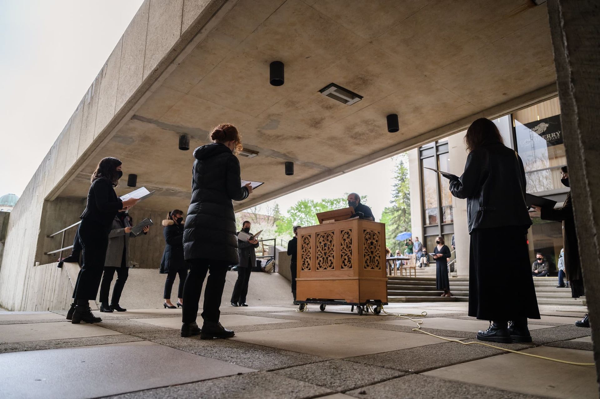 A choir performs outside.