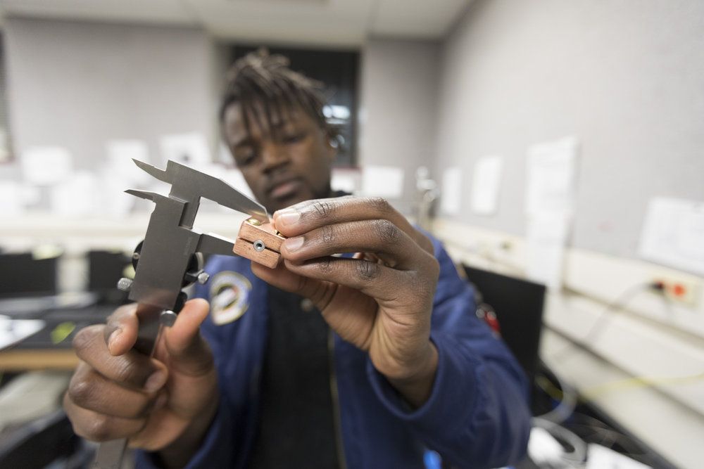 Physics major Daniel Mukasa ‘19 works best at night, so tweaking the construction of his prototype at 7:30 p.m. in Professor Stephen FitzGerald's lab makes perfect sense. The mechanism he designed focuses on separating out the rare but very useful isotope of hydrogen, called deuterium. "Daniel's prototype allows us to easily keep the separating tube at any desired temperature all the way down to the boiling point of liquid nitrogen, -320 F," explains FitzGerald.
