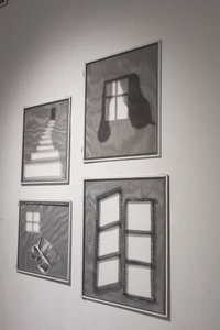 Four framed pictures on a wall