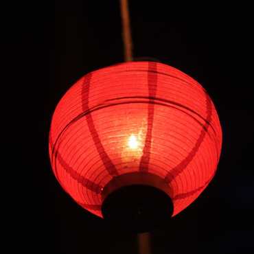 A close-up of a lantern at night