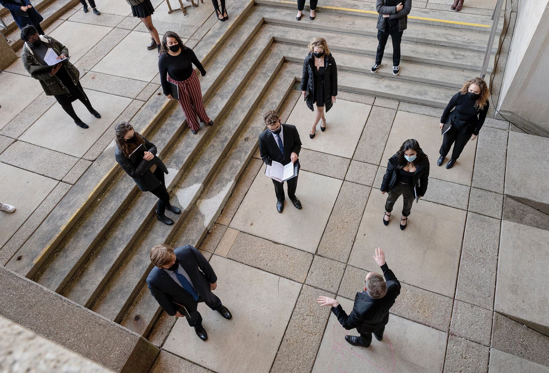 A choir performs outside.