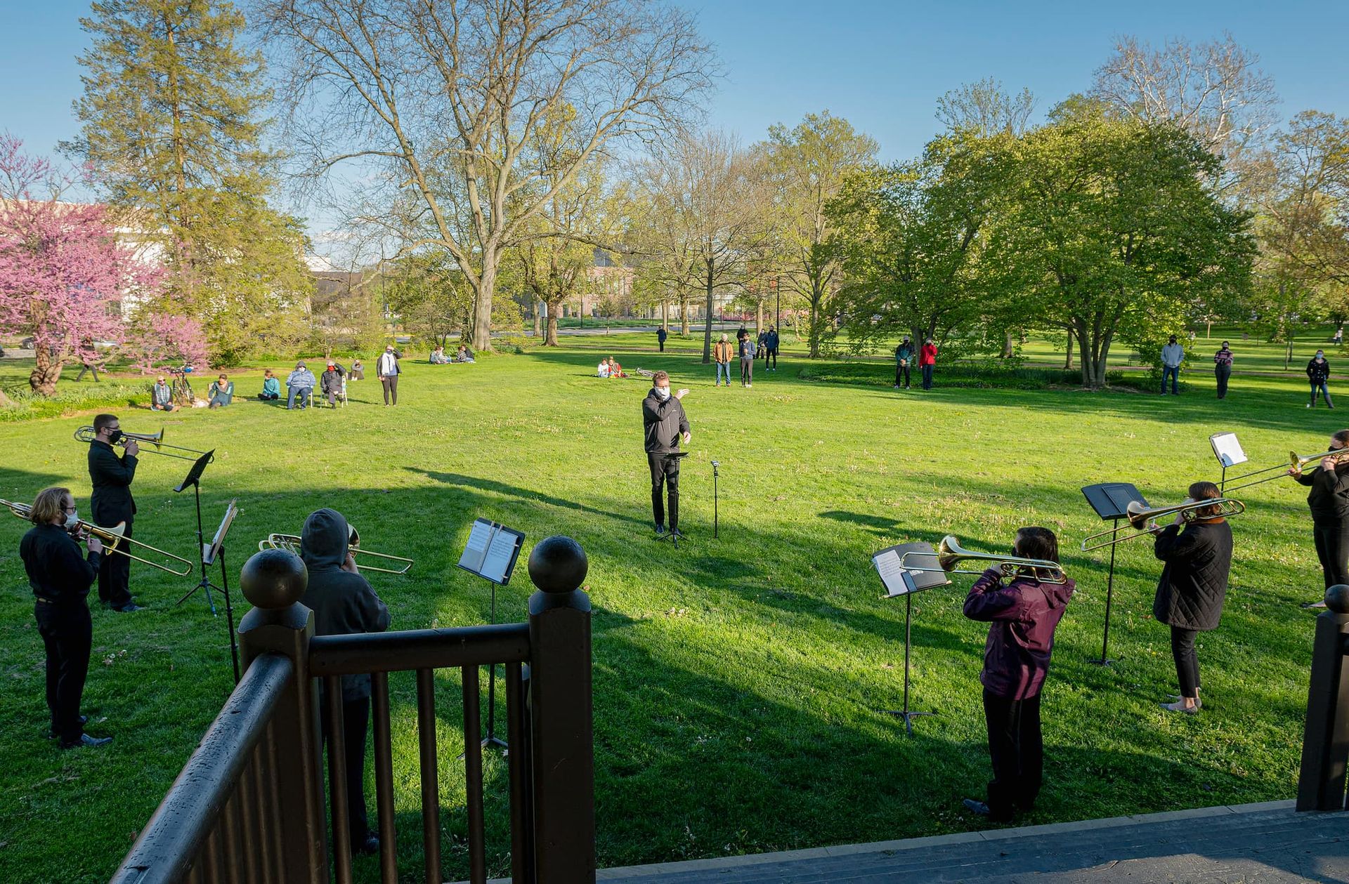 A trombone band performs in a park