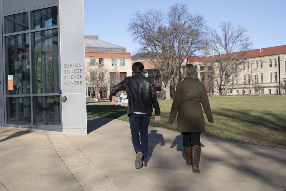 Two students walking next to the Science Center.