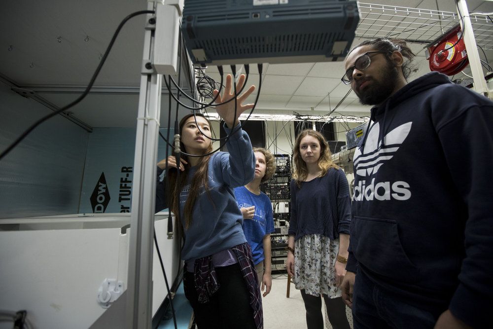 Sun Yool Park ‘19, Claire Segura ‘20, Eleda Fernald ‘22, and Dhruv Tandon ‘22, work on the construction of a SERF co-magnotometer for the Global Network of Optical Magnetometers for Exotic physics (GNOME) in Associate Professor Jason Stalnaker's laser lab.