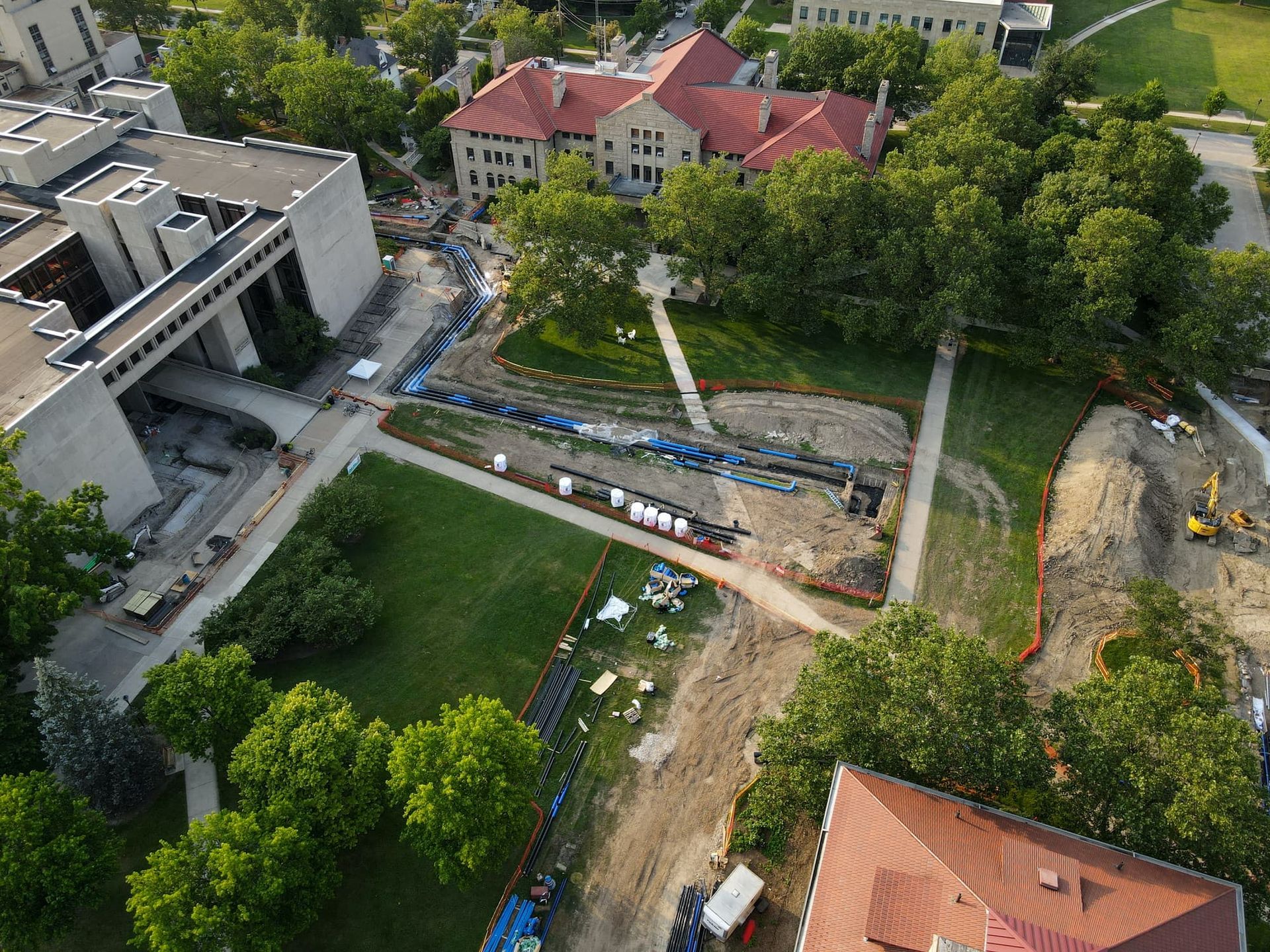 An aerial view of exposed pipes in a field.