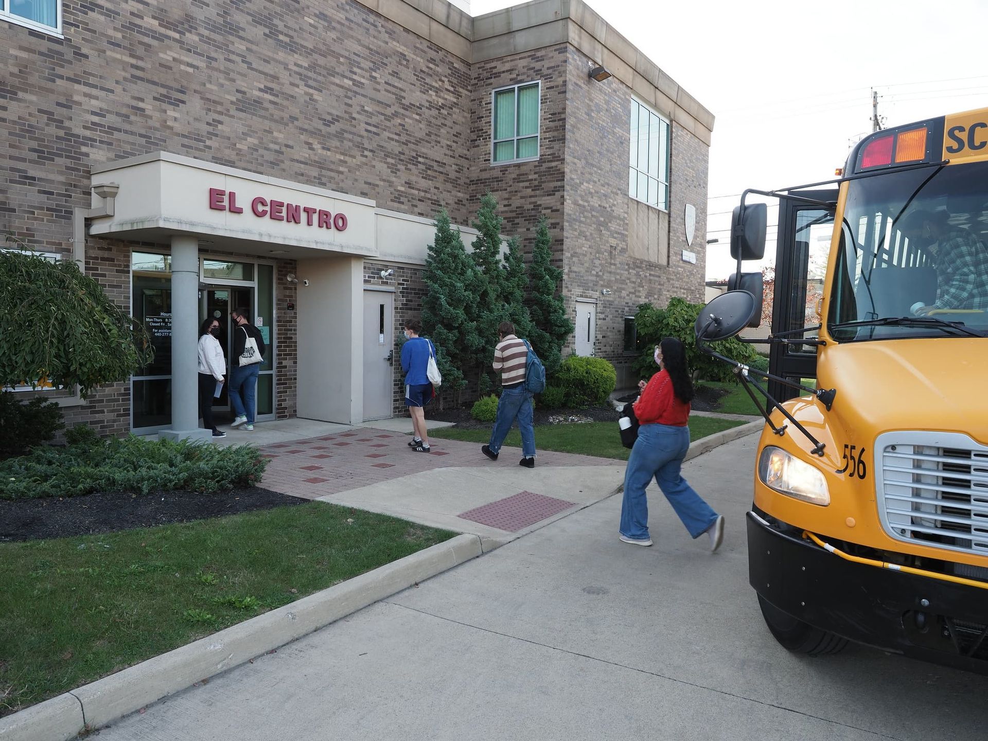 Students enter a building