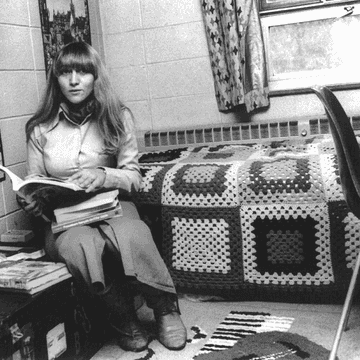 A crocheted throw cover, stuffed animal, and truck are featured in this room.