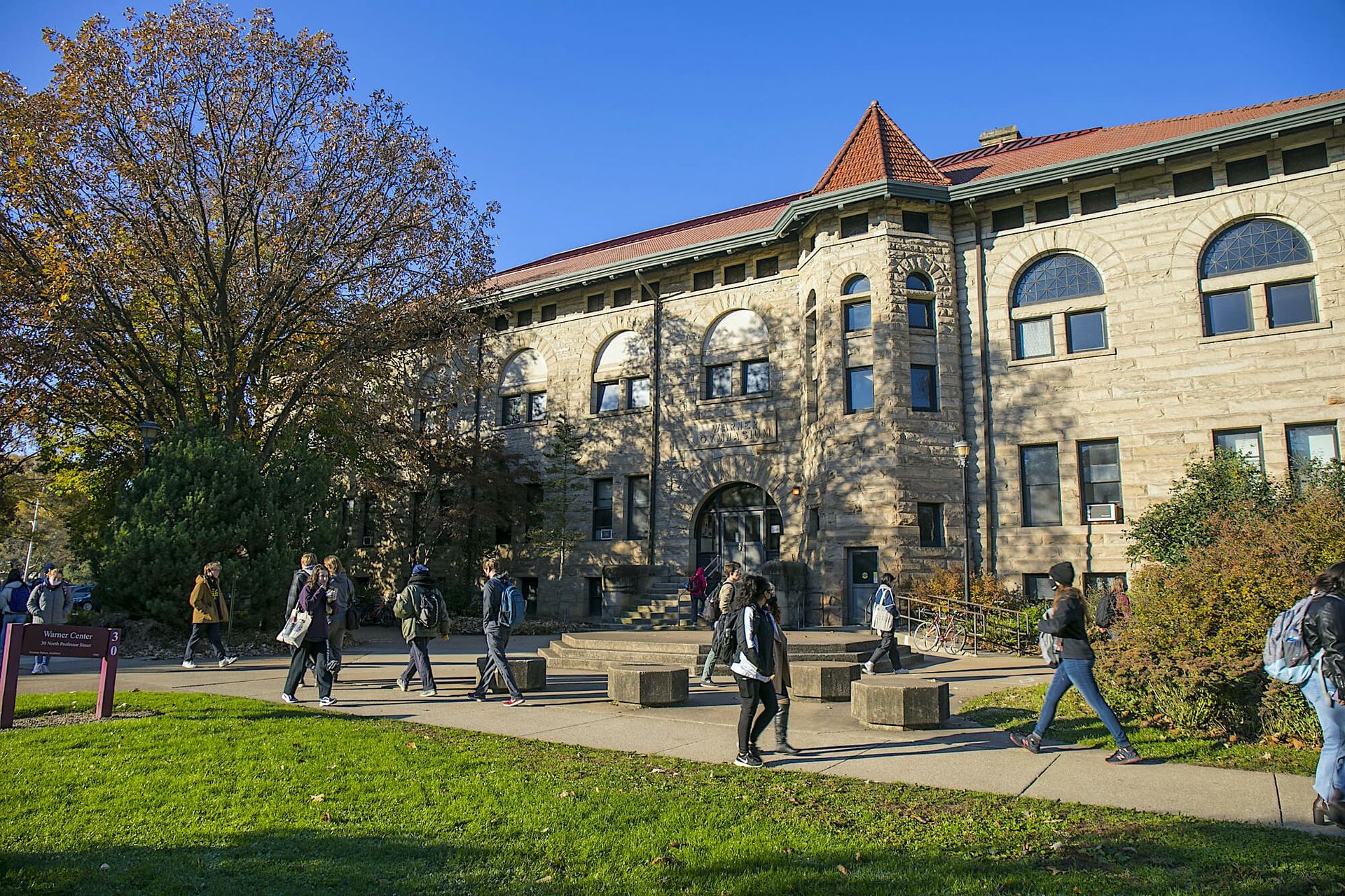 Students walk along a path.