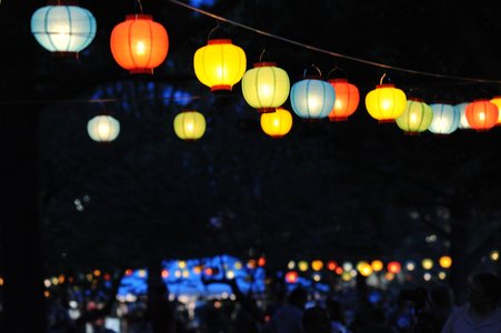 Hanging glowing lanterns in the dark 
