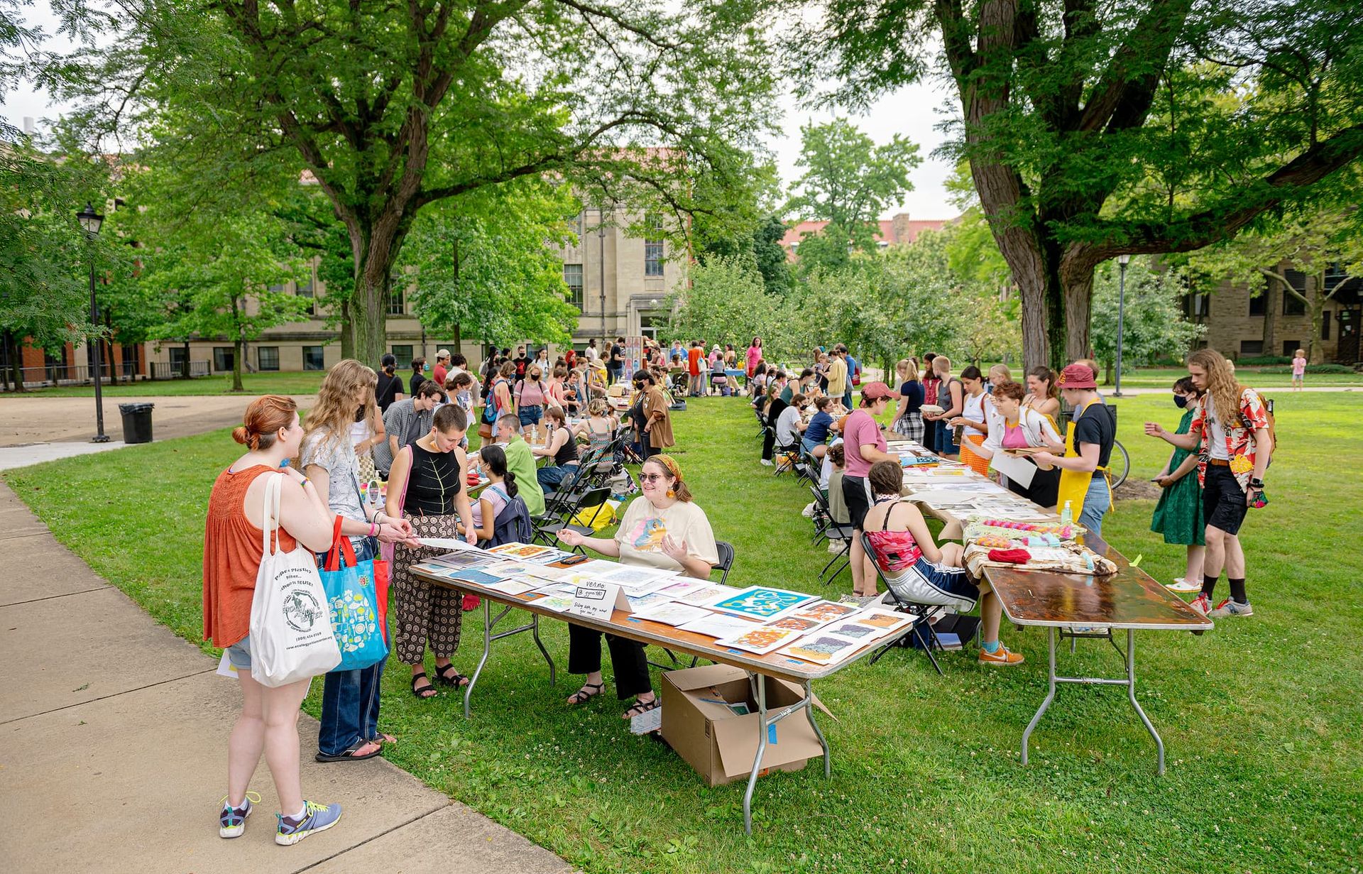 Students sale handmade items at a market.