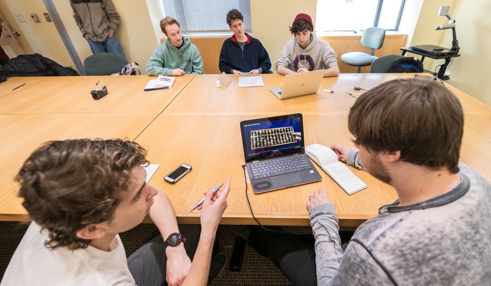 Simon Perales, a student at Oberlin High School (left) and Max Kramer '20 (right) along with Lucas Mendicino, Samuel Narvaez, and Dan Moramarco, all '21, explore mathematical cognition—the study of what takes place in the brain when humans do math. It's a project that meshes well with Kramer. During the school year, Kramer and 10 of his peers worked with Professor of Psychology Nancy Darling to develop 1step2life, a web-based app that helps adolescents manage chronic pain. The group was awarded a $20,000 prize through Oberlin's LaunchU competition.