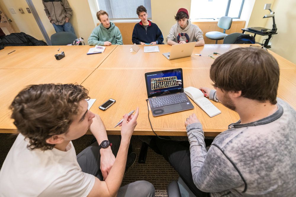 Simon Perales, a student at Oberlin High School (left) and Max Kramer '20 (right) along with Lucas Mendicino, Samuel Narvaez, and Dan Moramarco, all '21, explore mathematical cognition—the study of what takes place in the brain when humans do math. It's a project that meshes well with Kramer. During the school year, Kramer and 10 of his peers worked with Professor of Psychology Nancy Darling to develop 1step2life, a web-based app that helps adolescents manage chronic pain. The group was awarded a $20,000 prize through Oberlin's LaunchU competition.