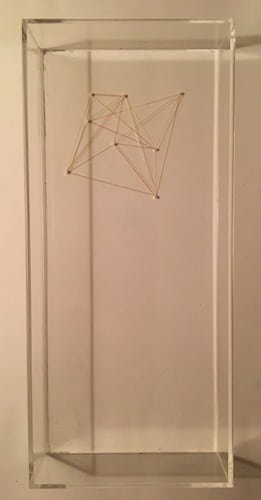 Strings and tacks make triangle shapes. 