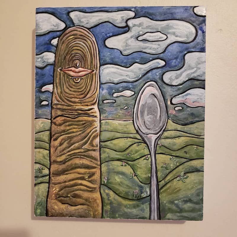 Small lips on a finger and a spoon