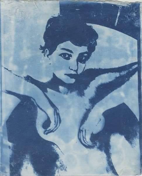 A picture of a nude woman covering her breasts with her hands.