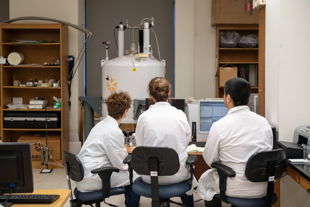 Sophie Lyon ‘22 (left), Jane Sedlak ‘19 (middle), and Haodaen Jiang '22 (right) make use of Oberlin’s 400 MHz Spectrometer in their research. In May, Sedlak was awarded a $50,000 Nexial Prize, which she will use to study stained glass conservation in Germany and England, as well as Batik dye creation in Indonesia. “I think that colors are the intersection of art and science, and that fascinates me because it contains questions about perception and culture as well as lessons about preservation,” says Sedlak '19.