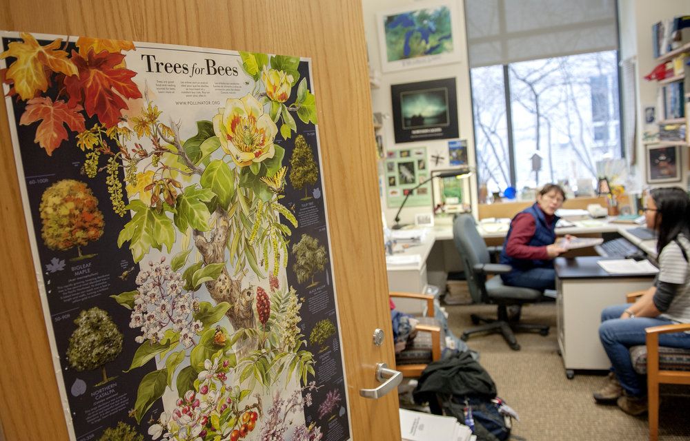 Open office door with teacher and student inside.