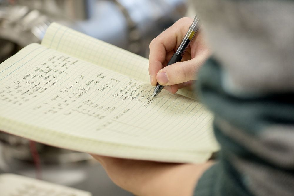 Student taking notes.