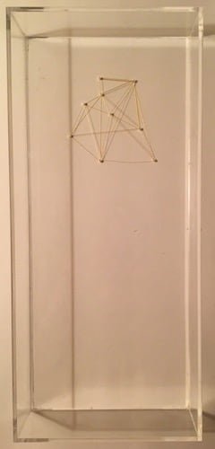 Strings and tacks make triangle shapes. 