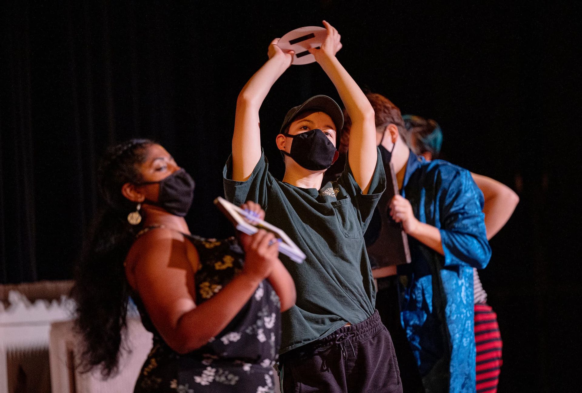Three students perform a modern dance number.