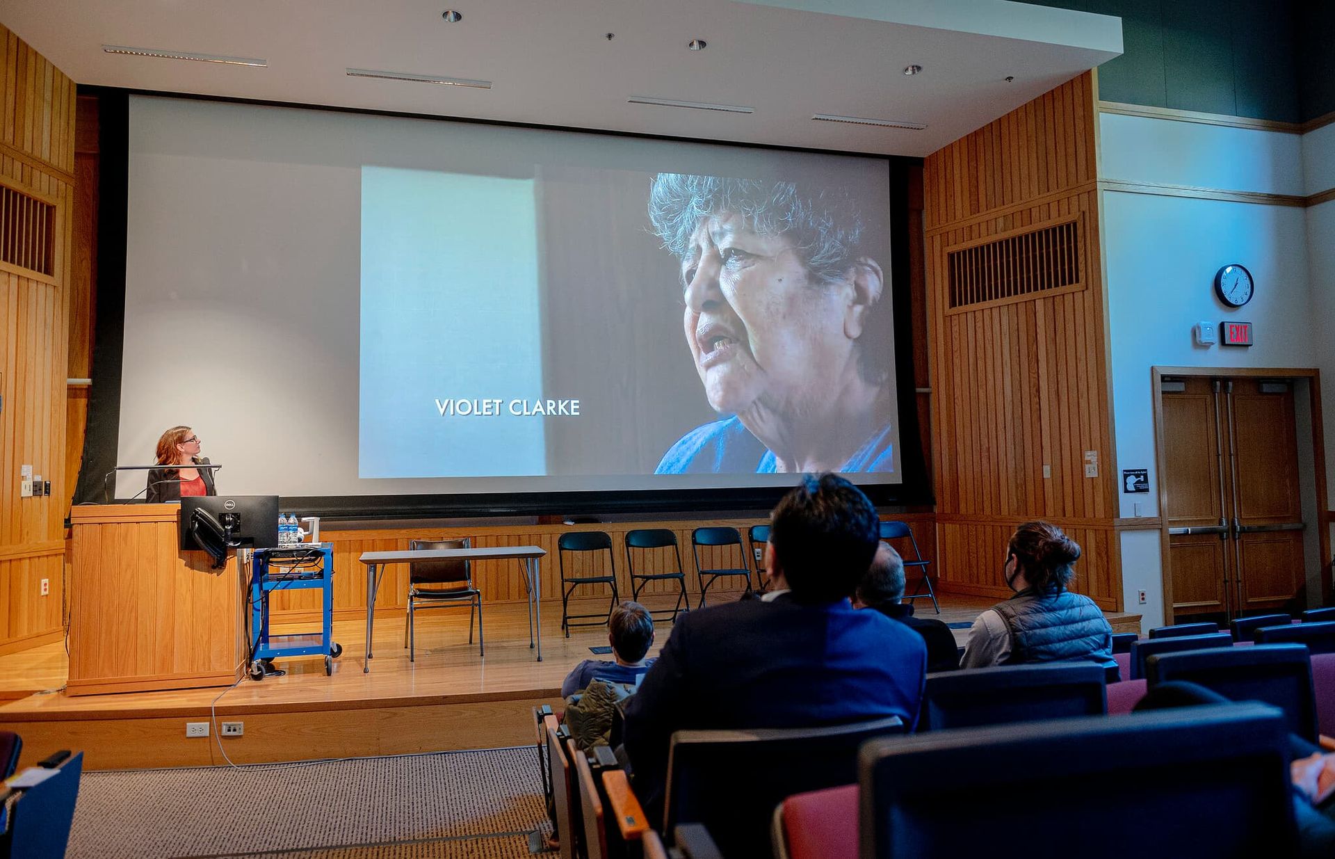 A woman speaks at a podium